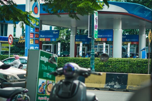 man in black helmet riding motorcycle on road during daytime