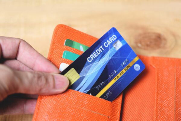 Credit card in wallet with hand