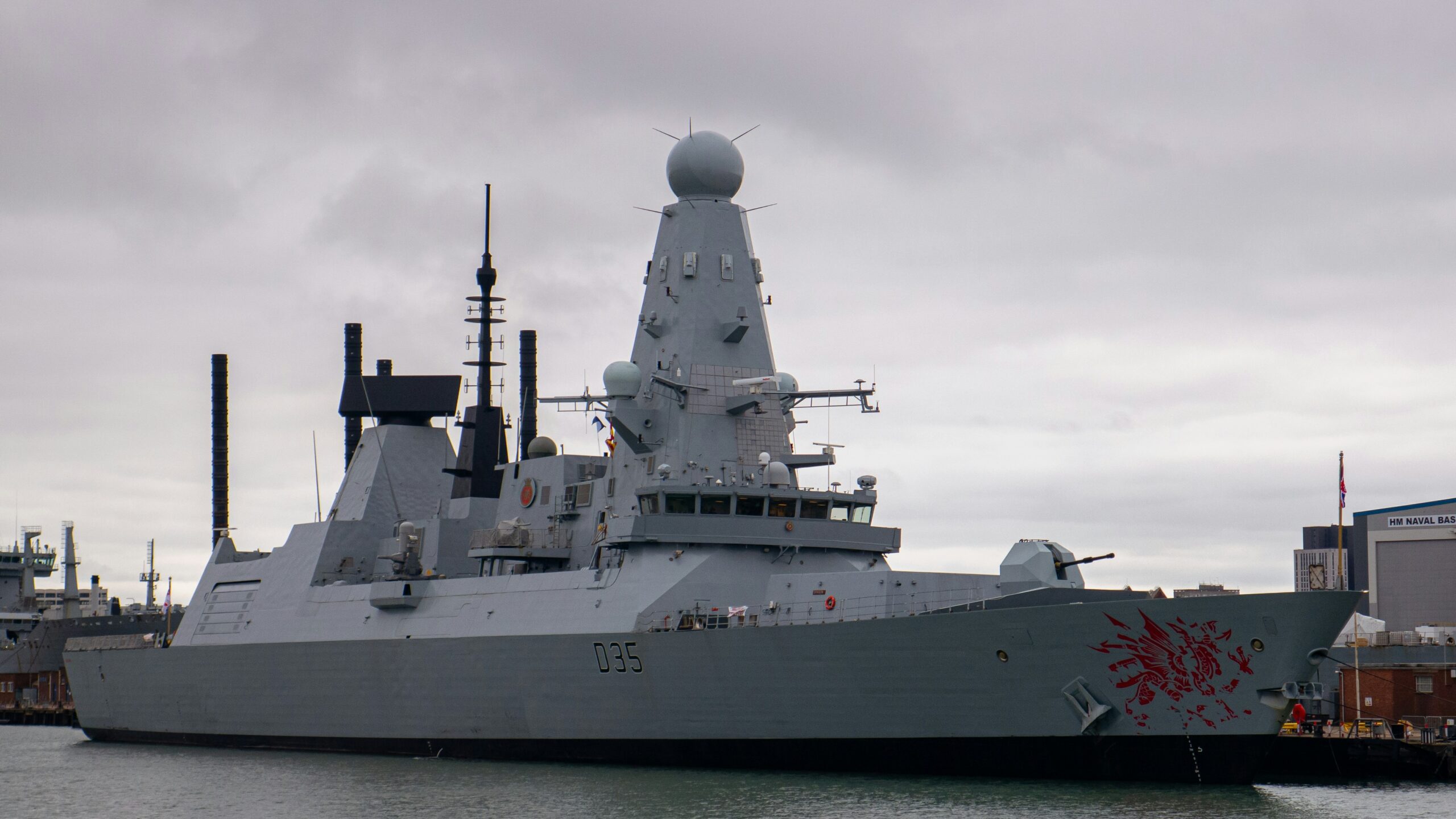 A large battleship sitting in the middle of a body of water