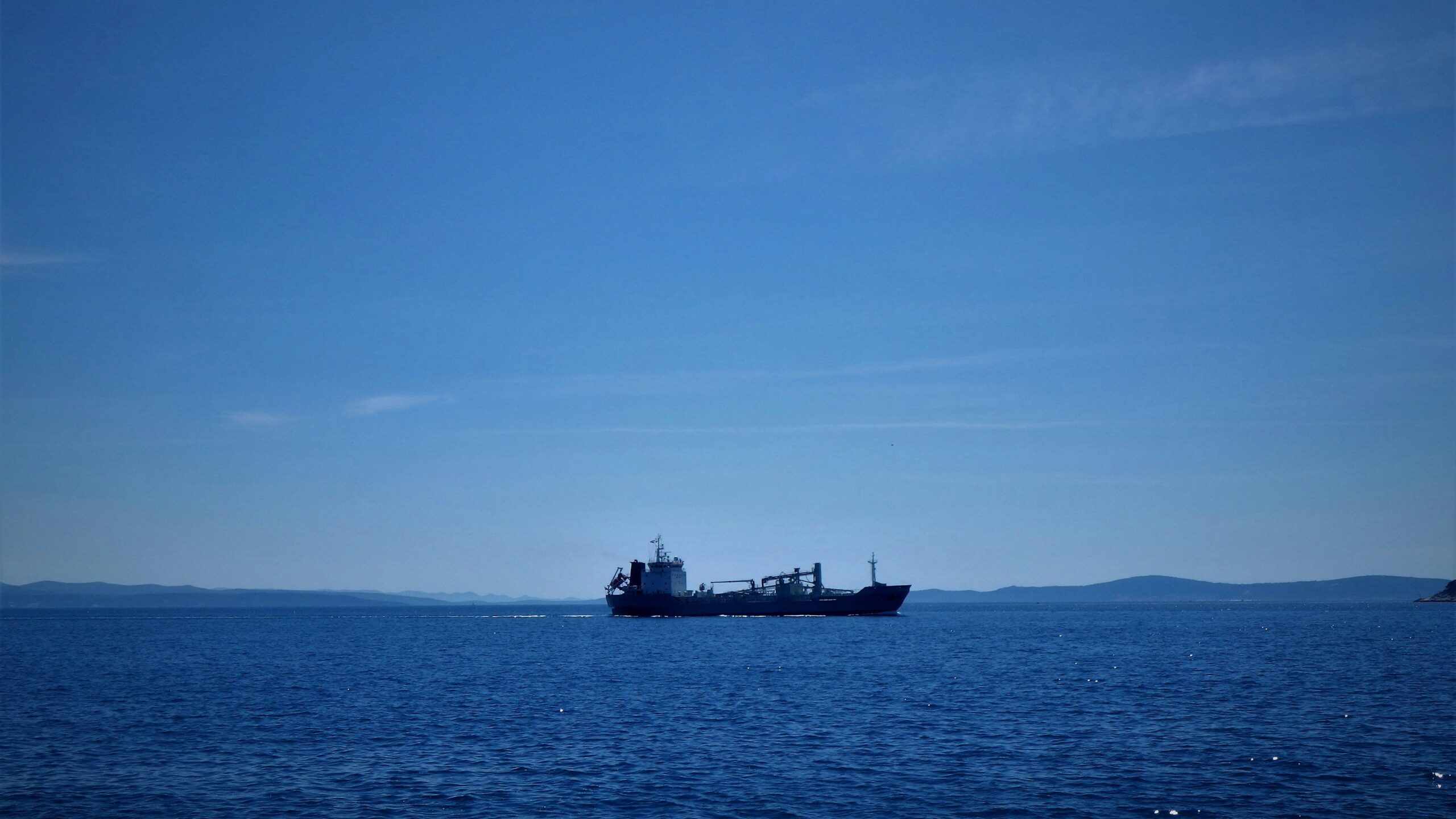 a large ship sailing across a large body of water