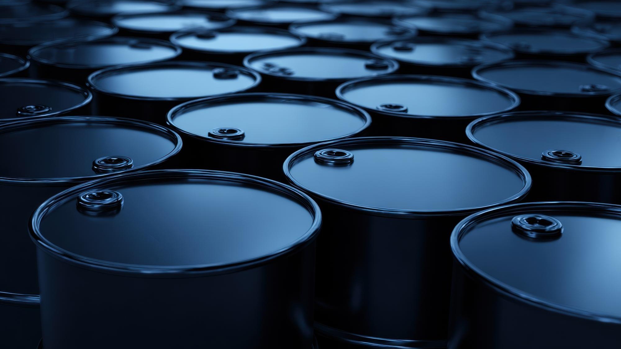 Oil barrels standing in rows representing the petroleum industry global energy supply production and storage concepts