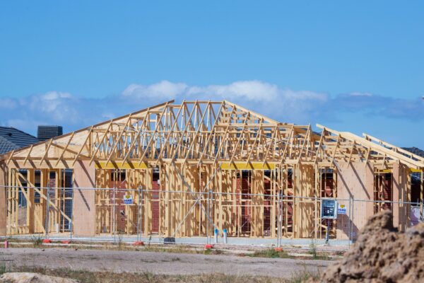 a house under construction in the middle of the day