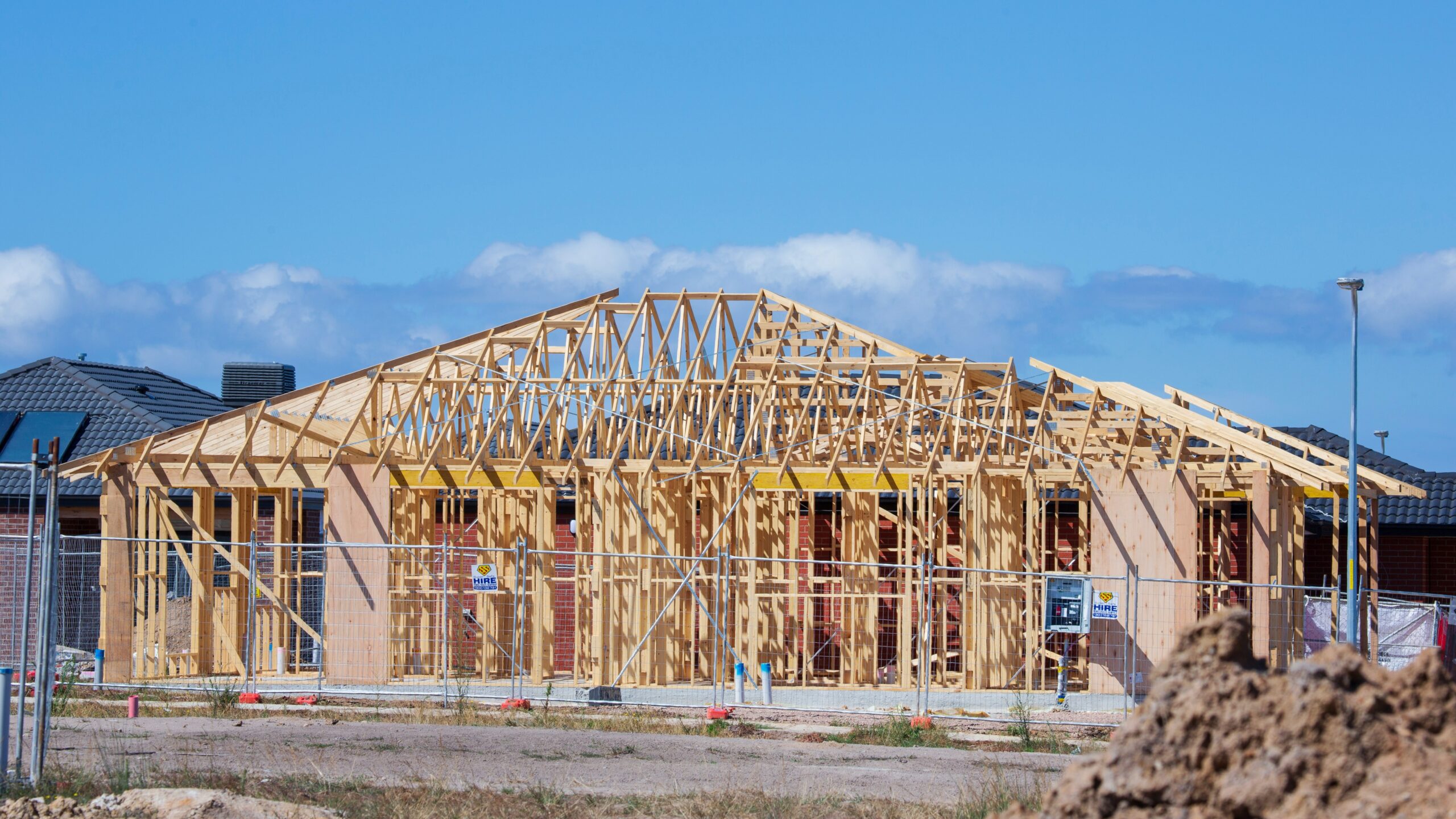a house under construction in the middle of the day