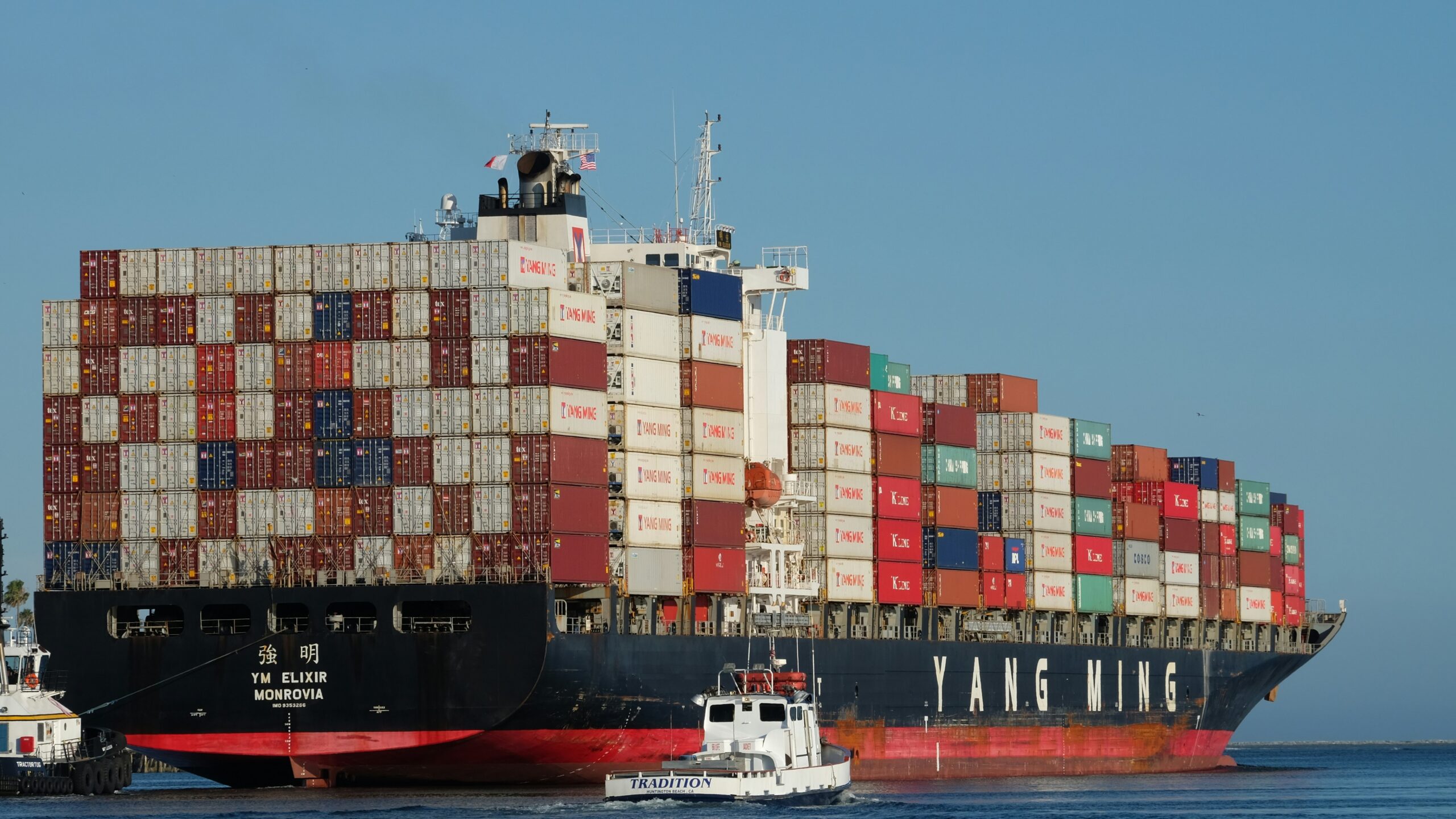 black and red ship on body of water at daytime