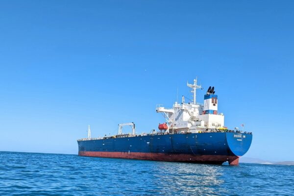 a large boat floating on top of a body of water