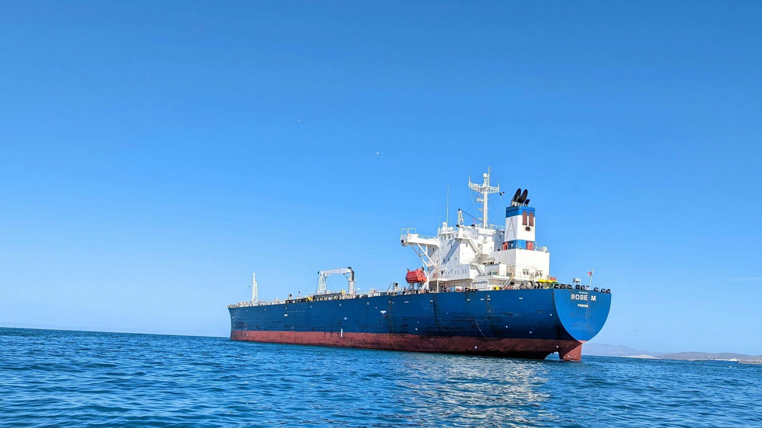 a large boat floating on top of a body of water