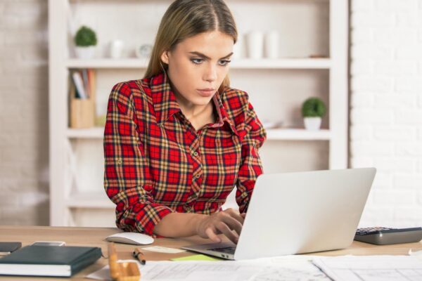 Female using laptop at desk