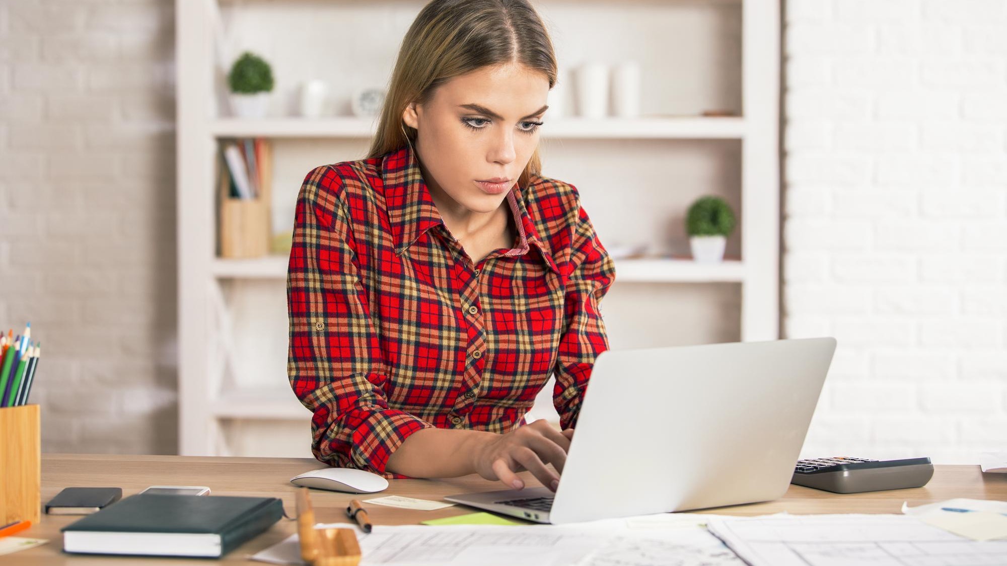 Female using laptop at desk