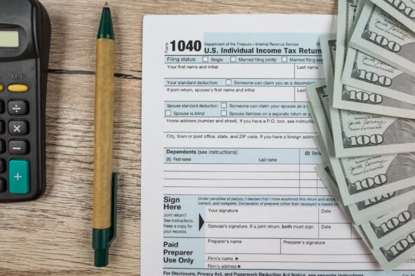 1040 tax form on a wooden table Tax time Financial concept