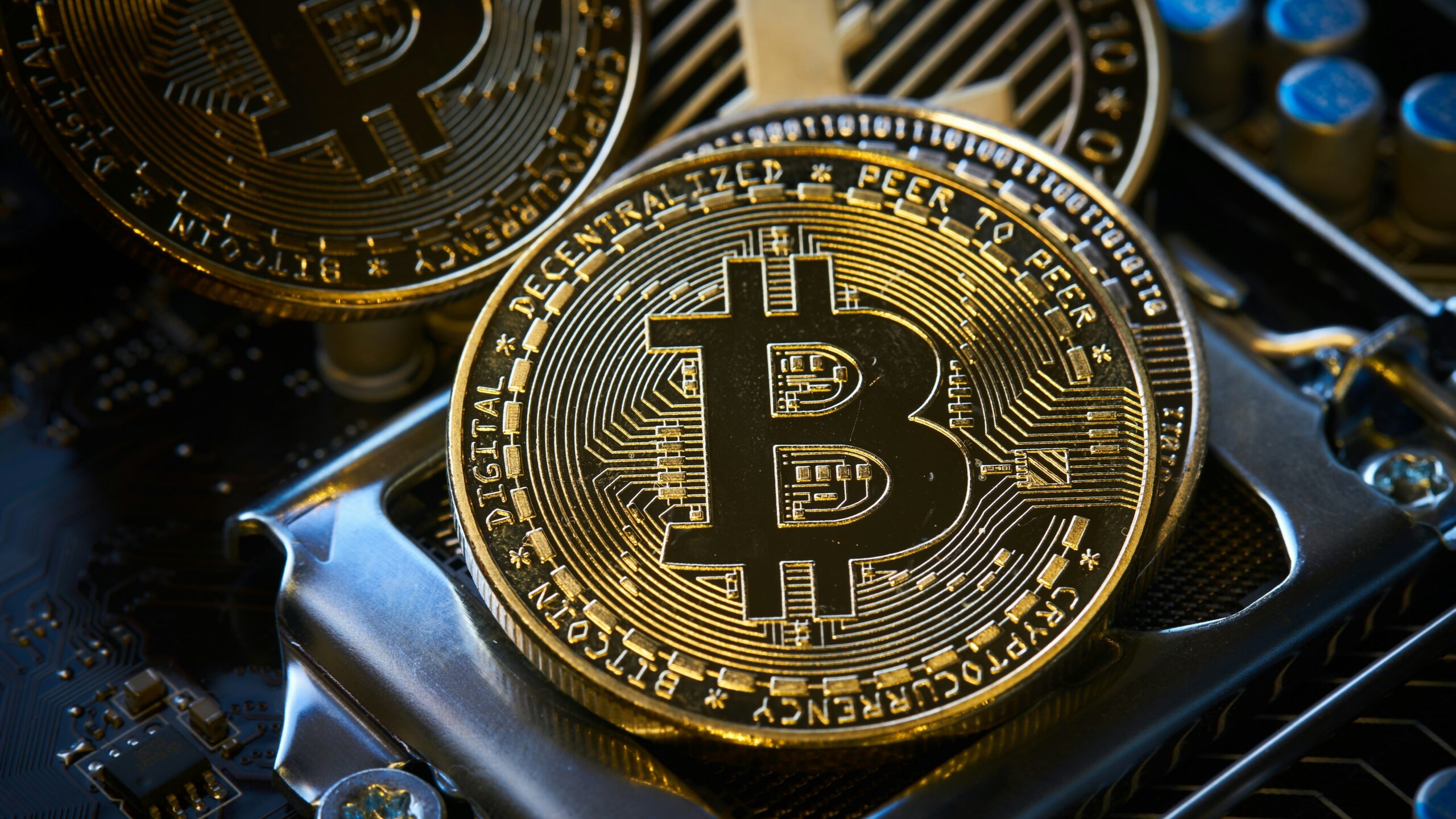 a bitcoin sitting on top of a computer motherboard