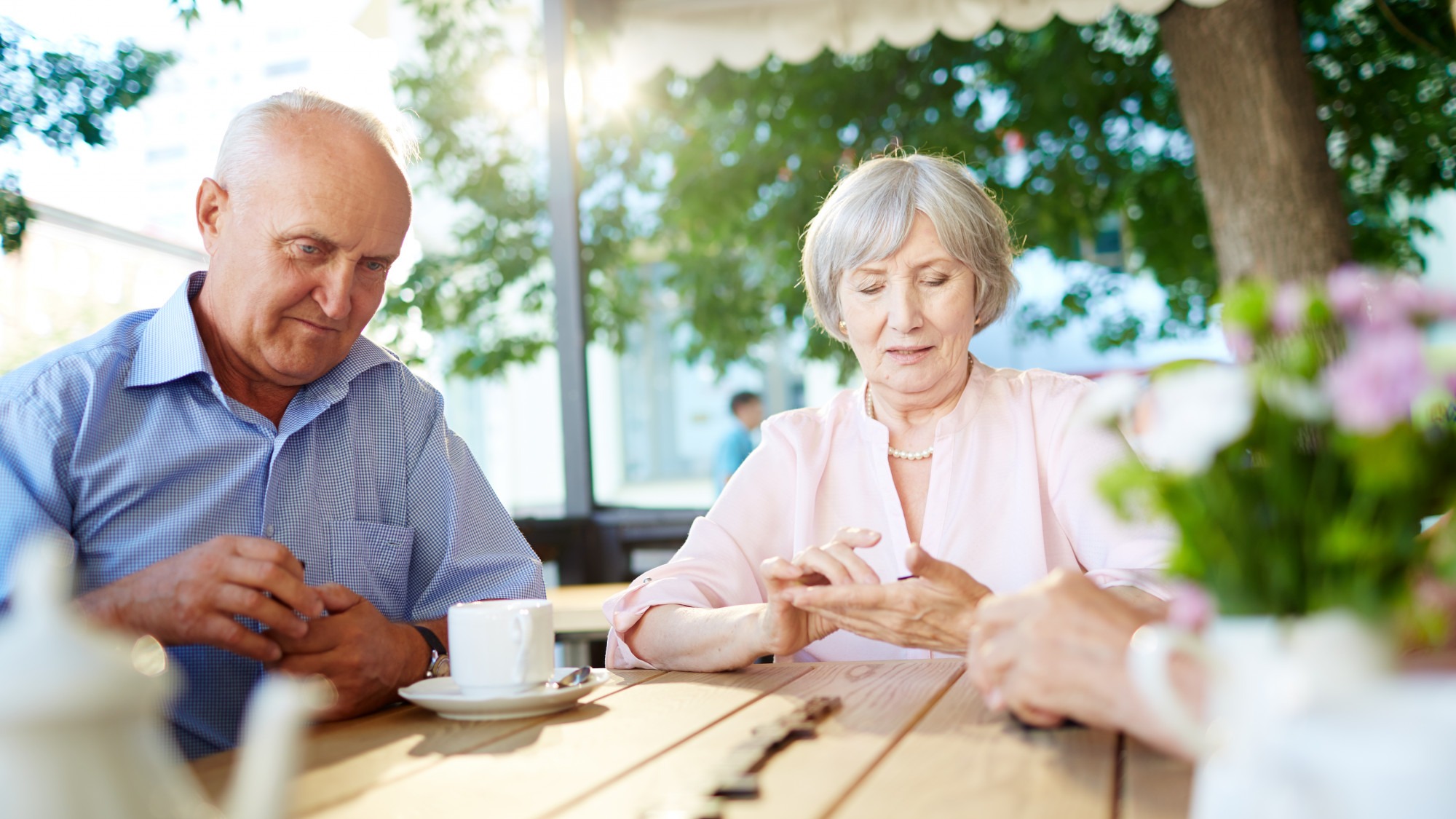 Senior people playing dominoes