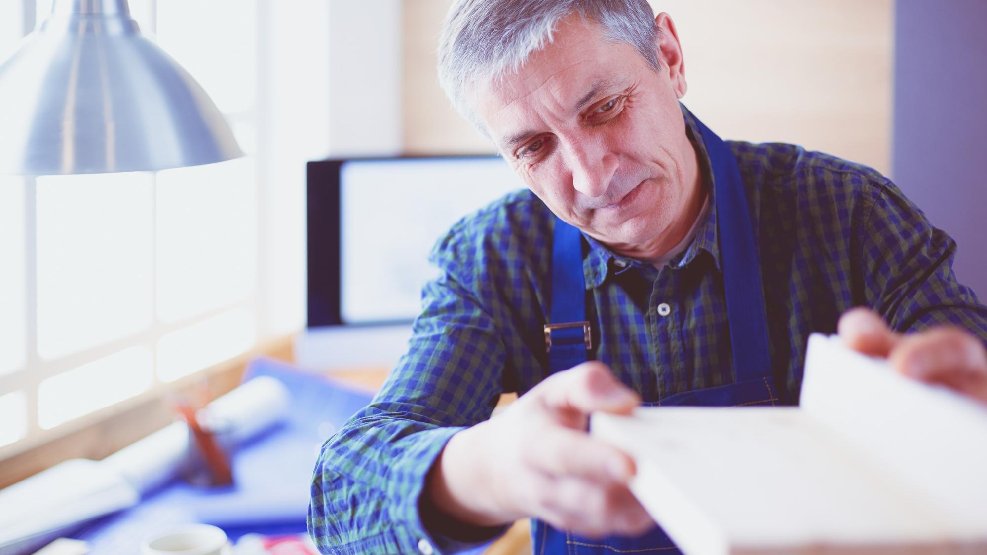 Architect working on drawing table in office