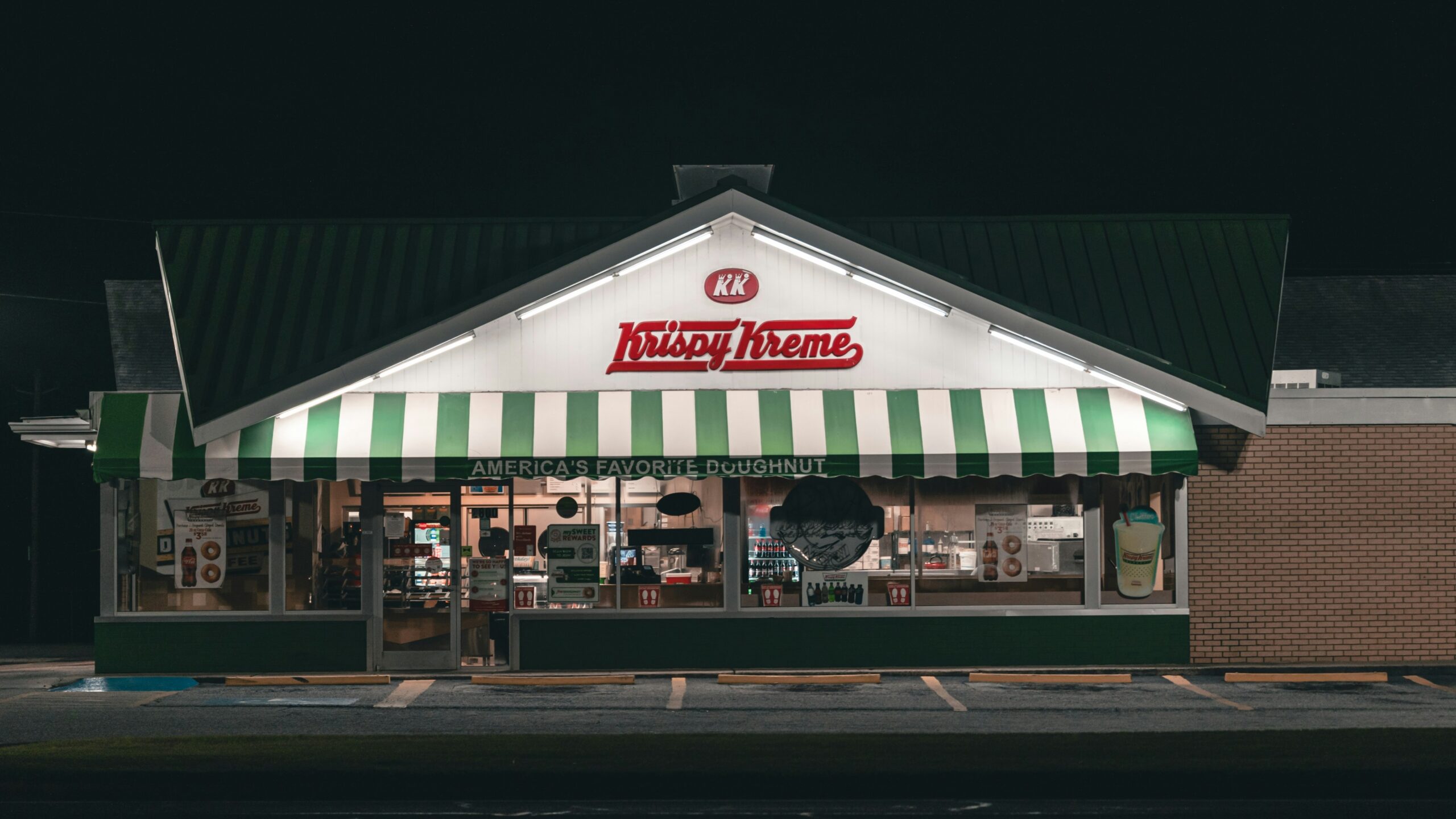 white and green food store during night time