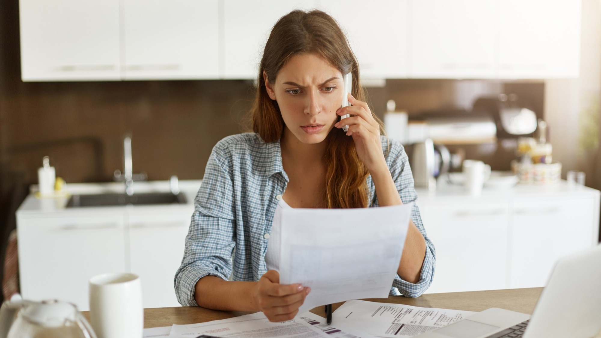 Young woman checking her budget and doing taxes