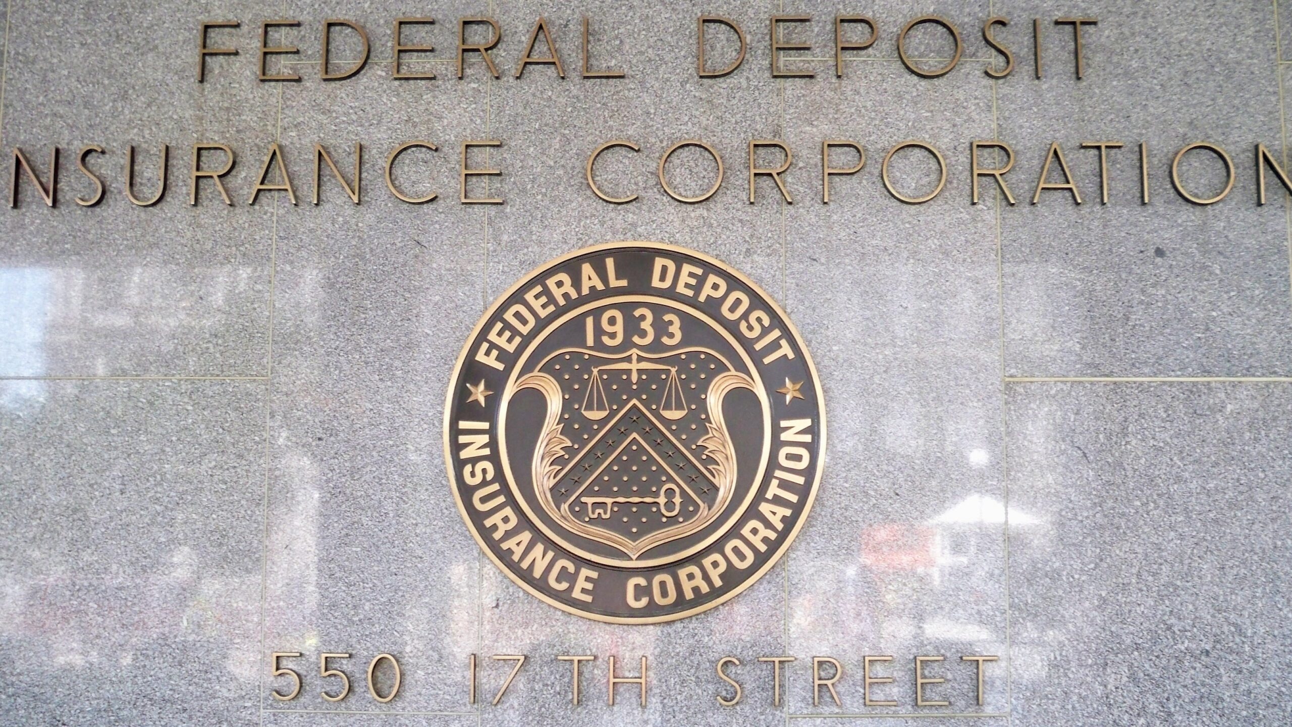 FDIC seal in front of the headquarters building by the White House.