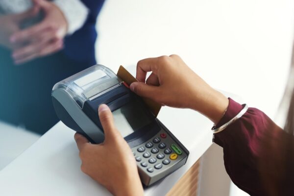 Credit card payment swipe or hands of person in mall with pos machine in a financial exchange B2c fintech sales services or closeup of customer paying swiping or shopping in retail store trade