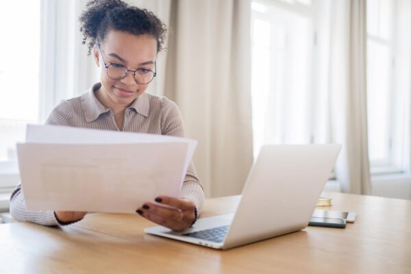 Finance and budget uses a laptop a woman with glasses a manager works in the office