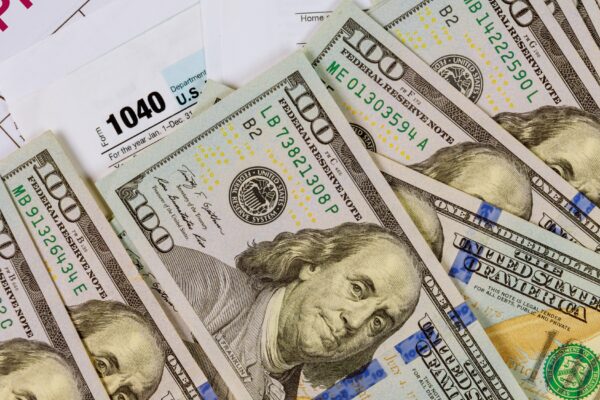 1040 tax return form income completing irs individual tax pay and US dollar banknotes