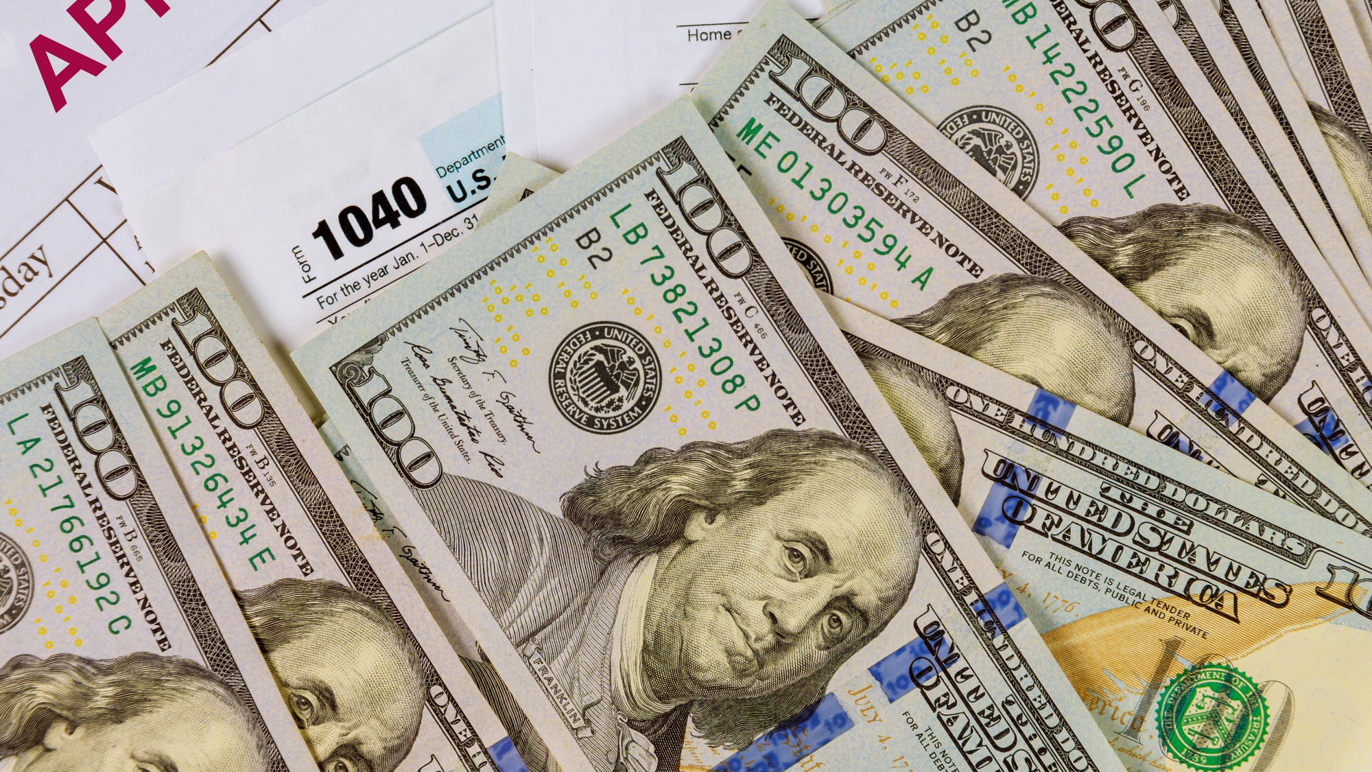 1040 tax return form income completing irs individual tax pay and US dollar banknotes