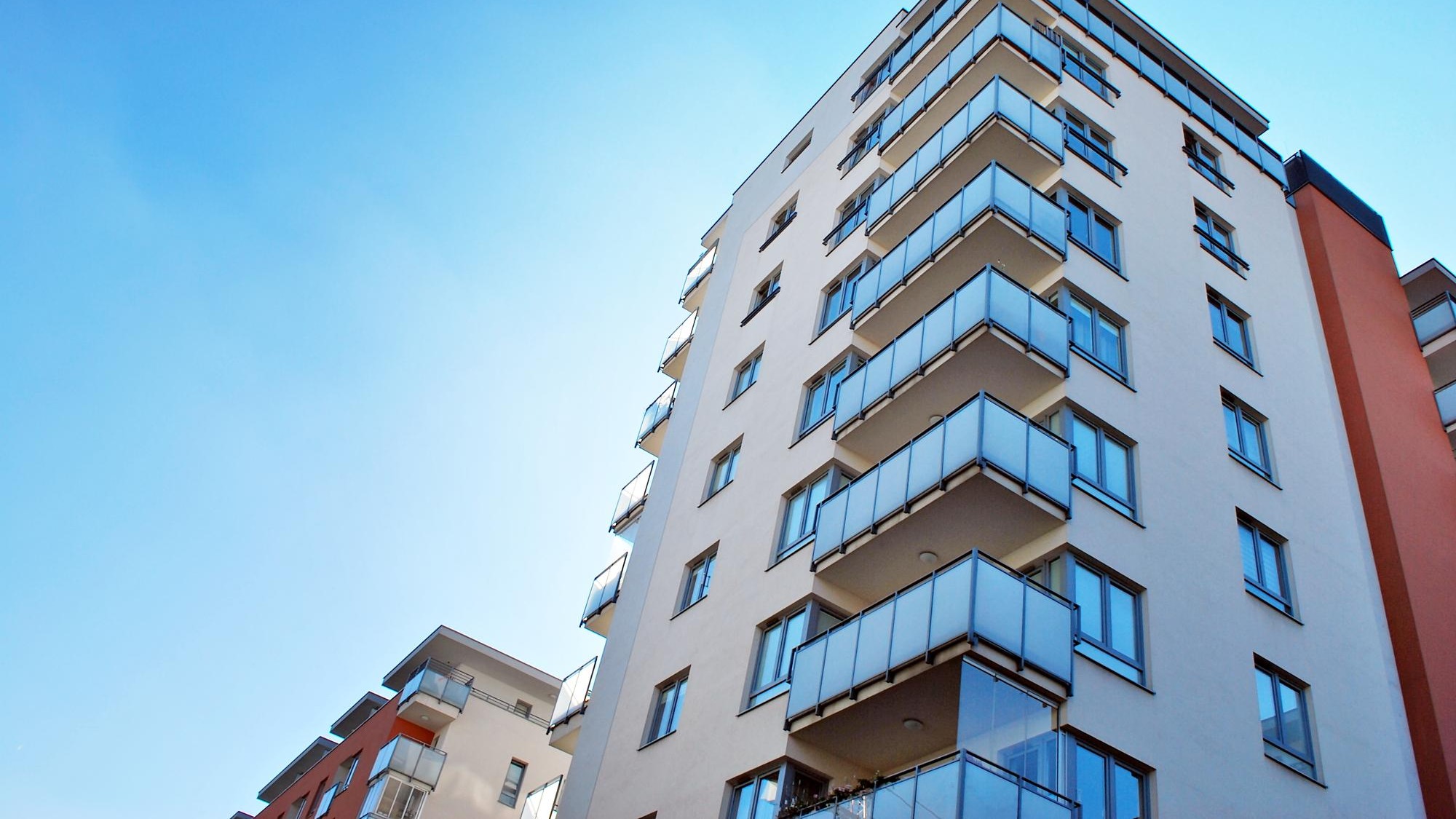 New apartment building with glass balconies Modern architecture houses by the sea
