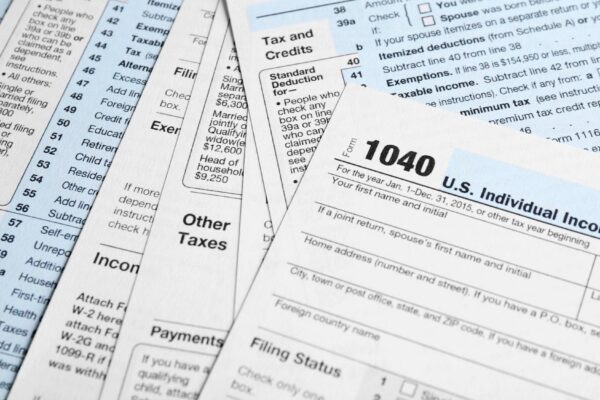 Individual Tax Return Forms on table
