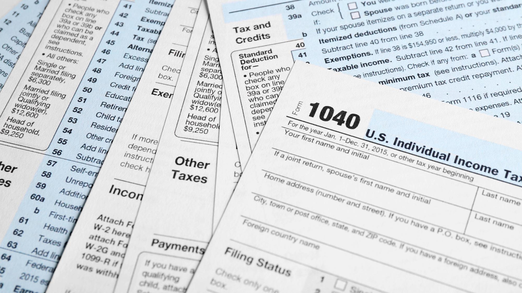 Individual Tax Return Forms on table