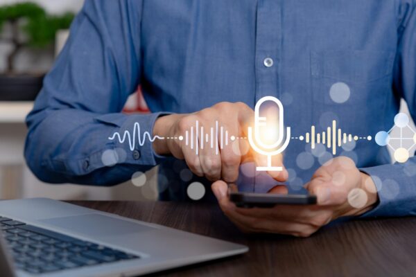 Man Using Voice Control on Smartphone for AI Assistant