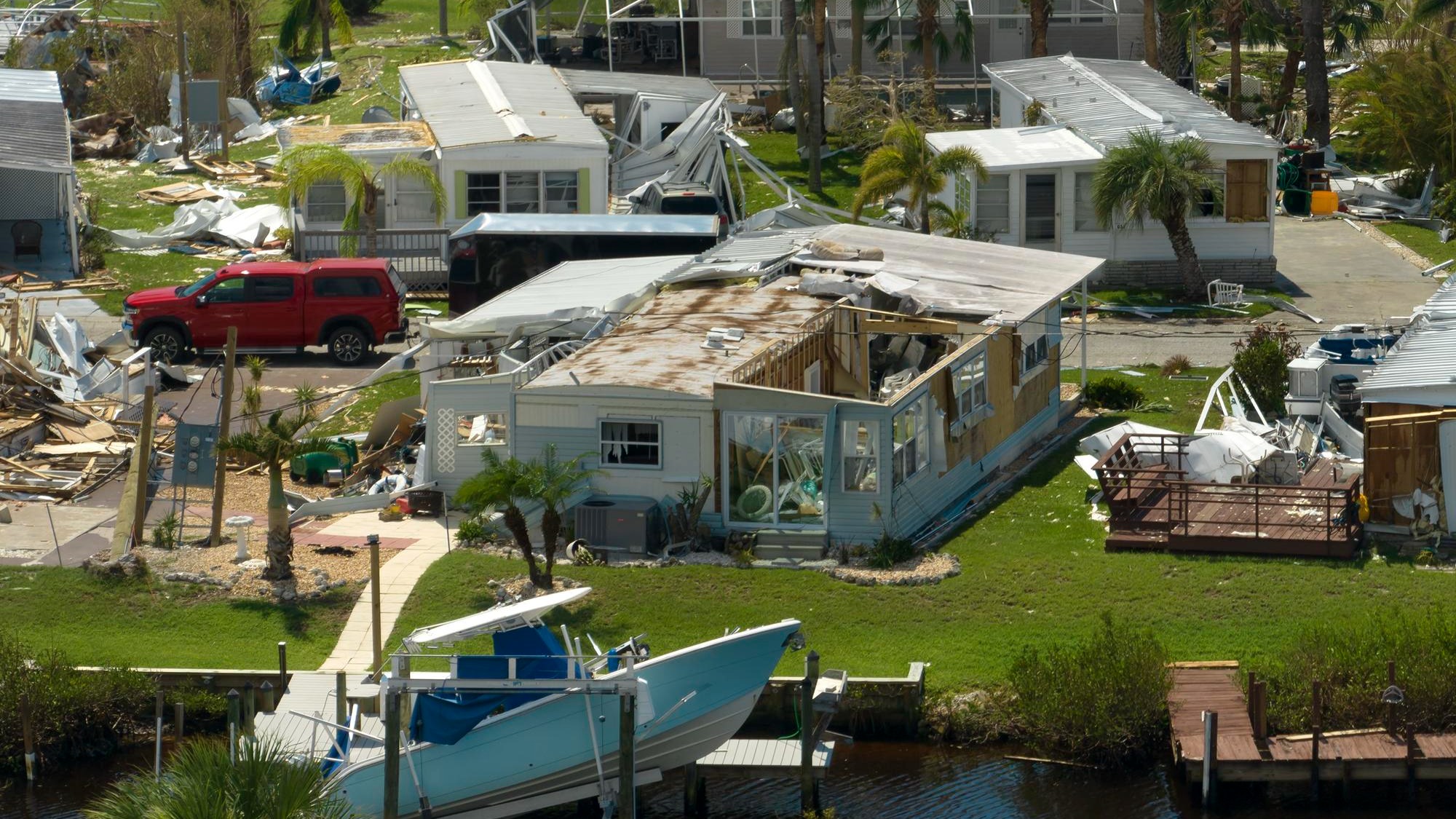 View from abover of damaged mobile homes after hurricane Ian in Florida residential area Consequences of natural disaster