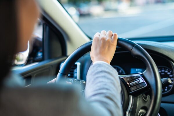 Businesswoman driving her car in the city