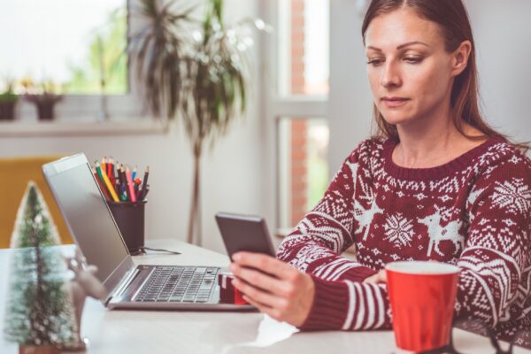 Women using smart phone in the home office