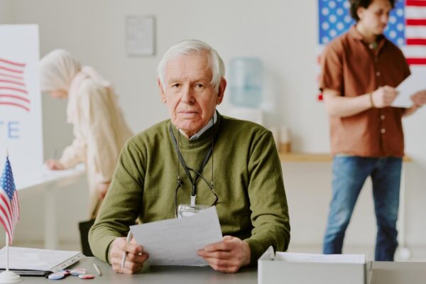 Senior man at workplace at electoral district