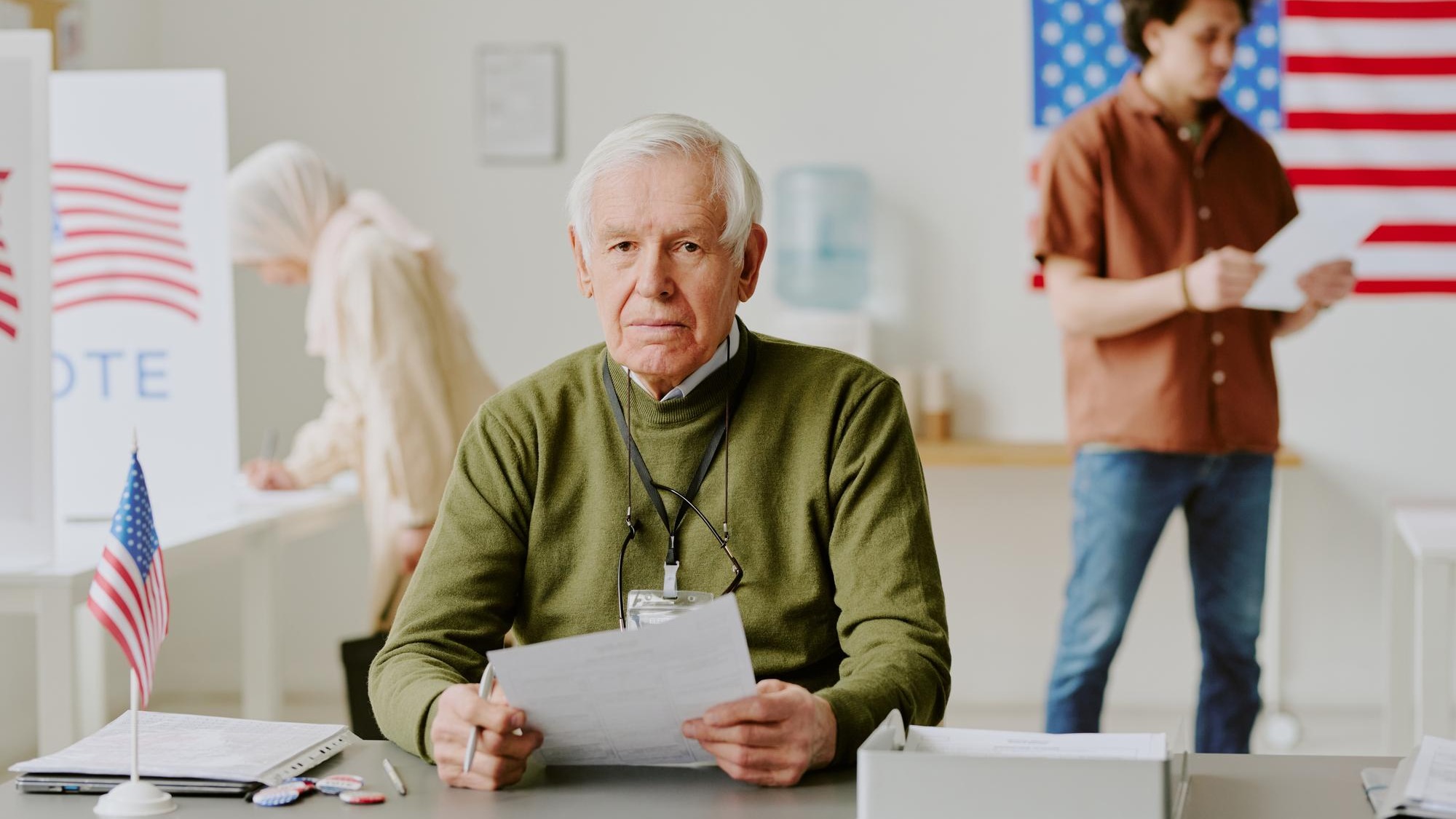 Senior man at workplace at electoral district