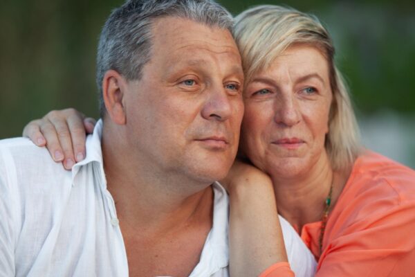 Portrait of couple kissing outdoors