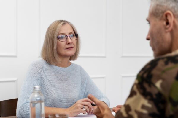 Person suffering from ptsd at psychologist