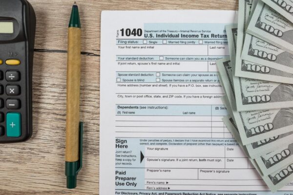 1040 tax form on a wooden table Tax time Financial concept