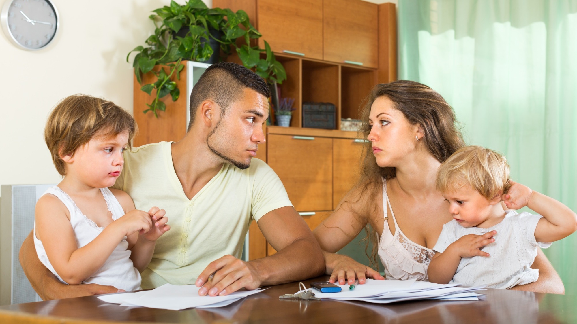 Parents with children having quarrel