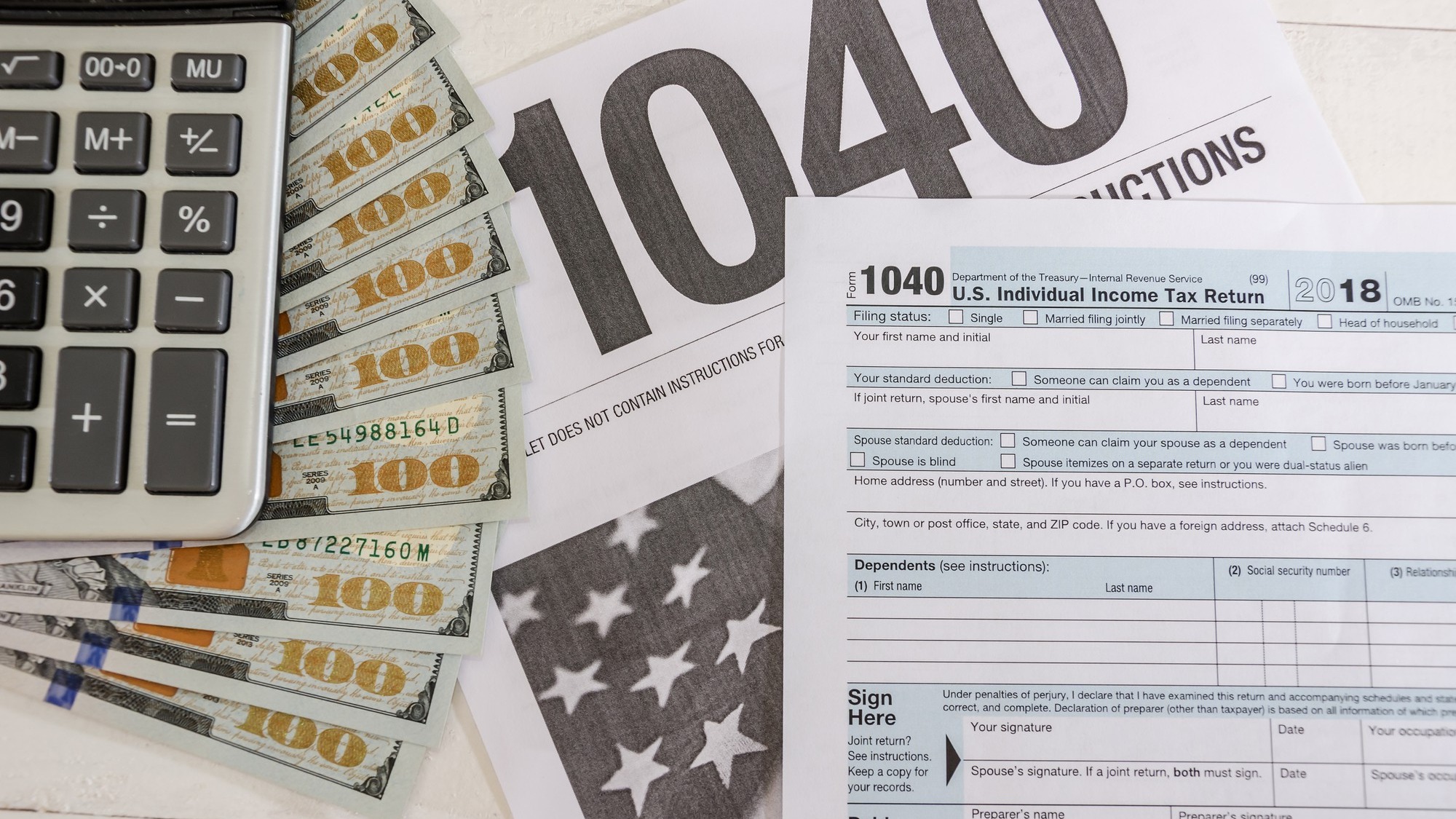 tax forms 1040 and dollars