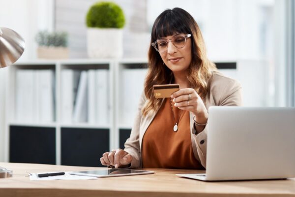 Woman credit card and tablet in office with online shopping app or typing with info sale or deal Person touchscreen and fintech for easy banking click or ecommerce with bills budget or finance