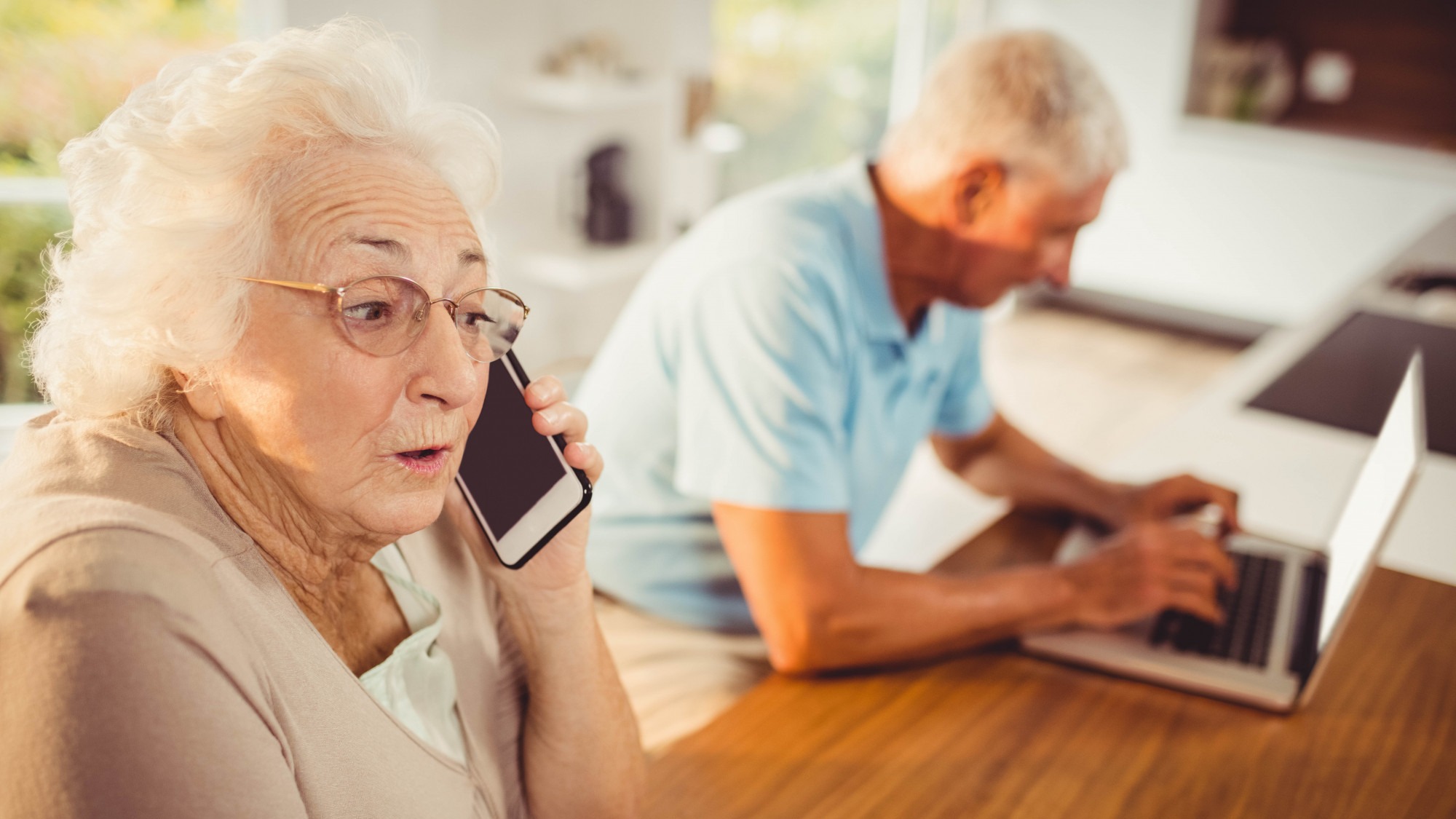 Senior woman on a phone call at home
