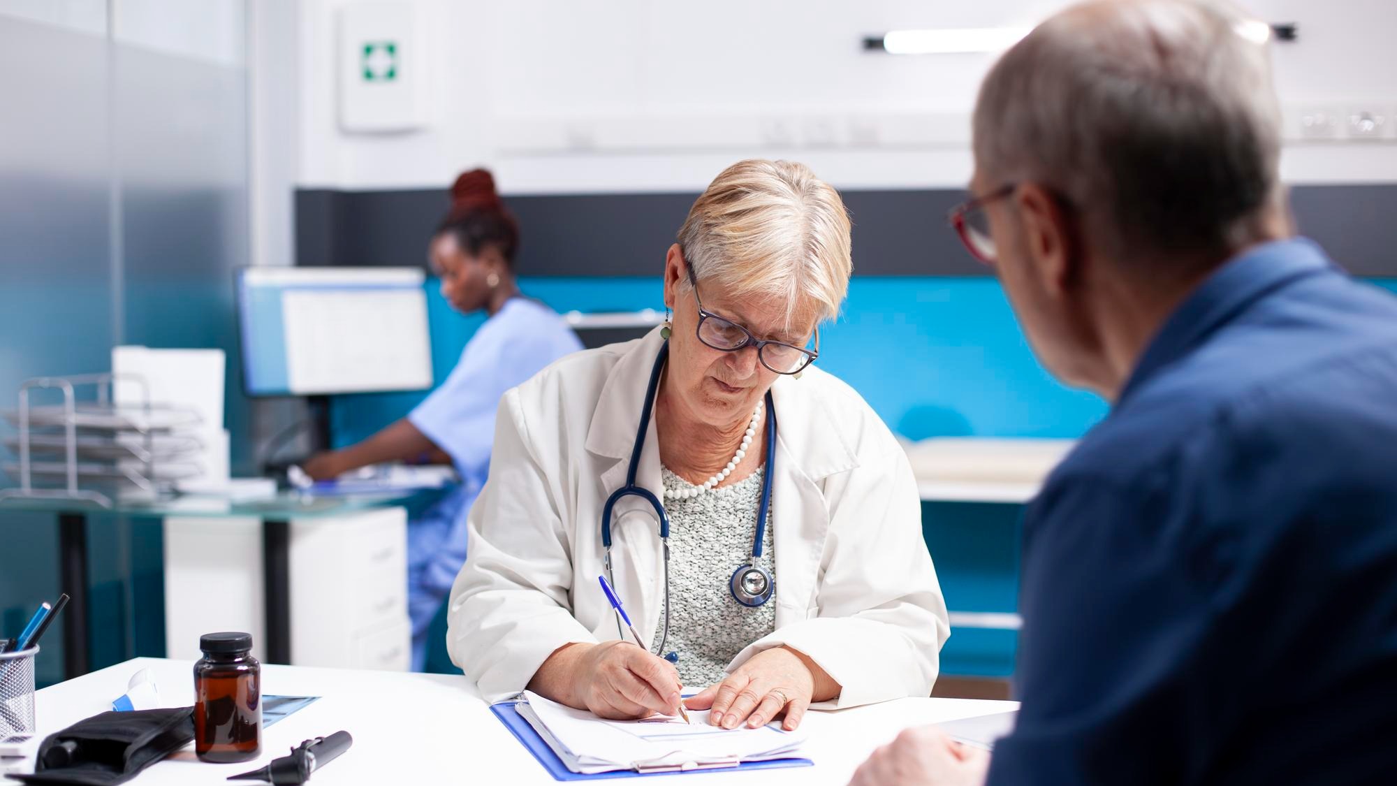 Doctor writing medical instructions