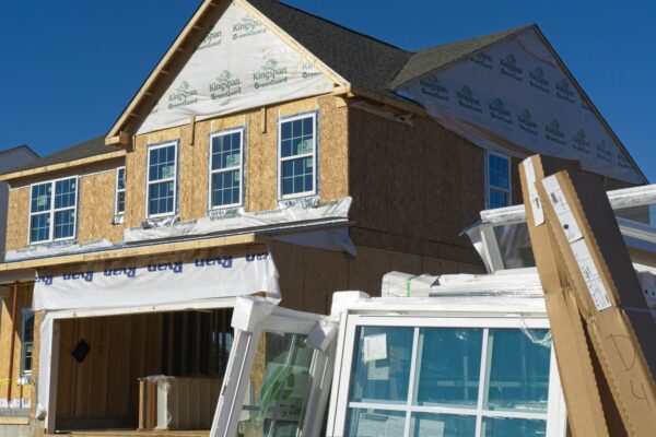 a house under construction with the roof ripped off