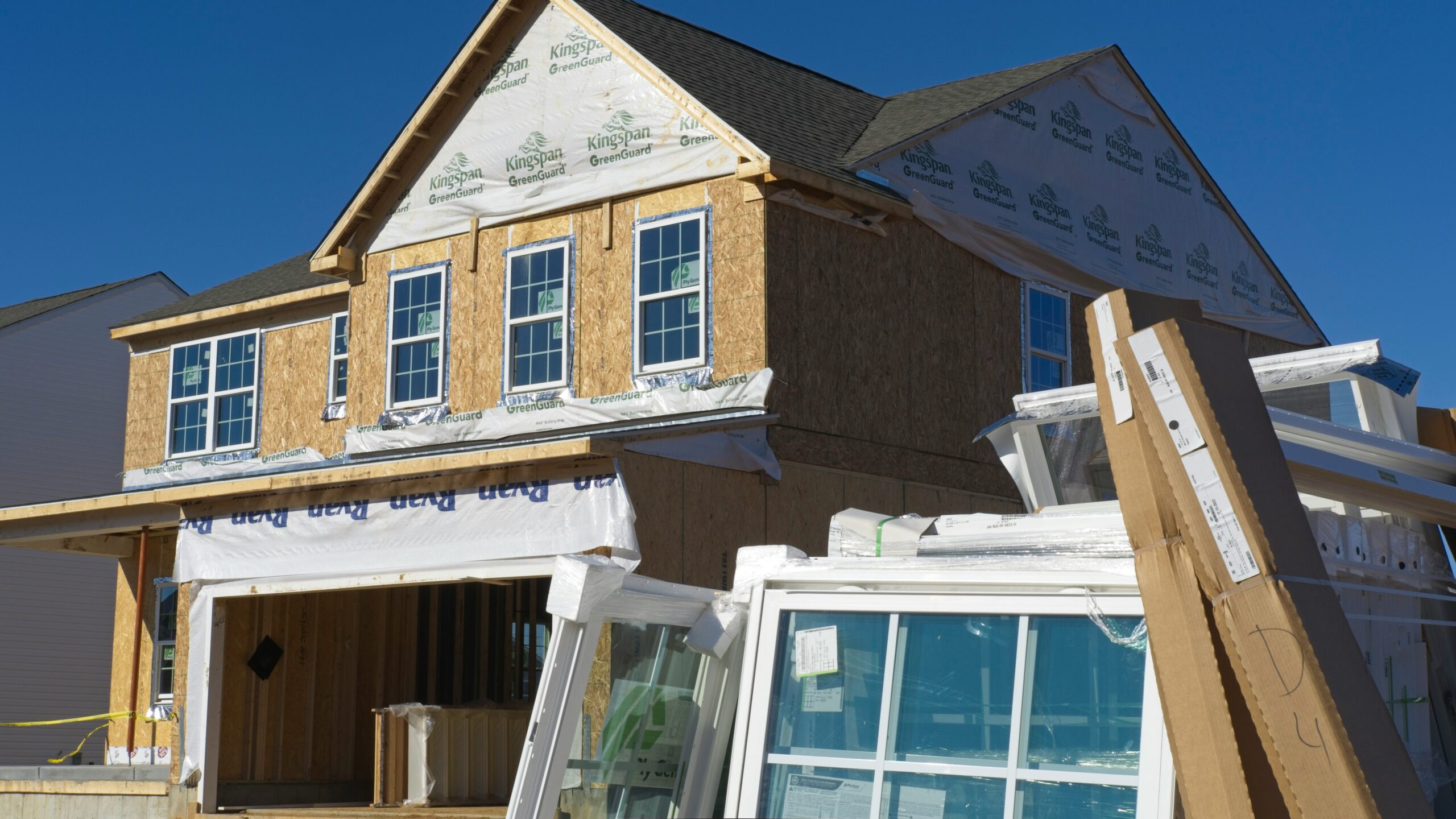 a house under construction with the roof ripped off
