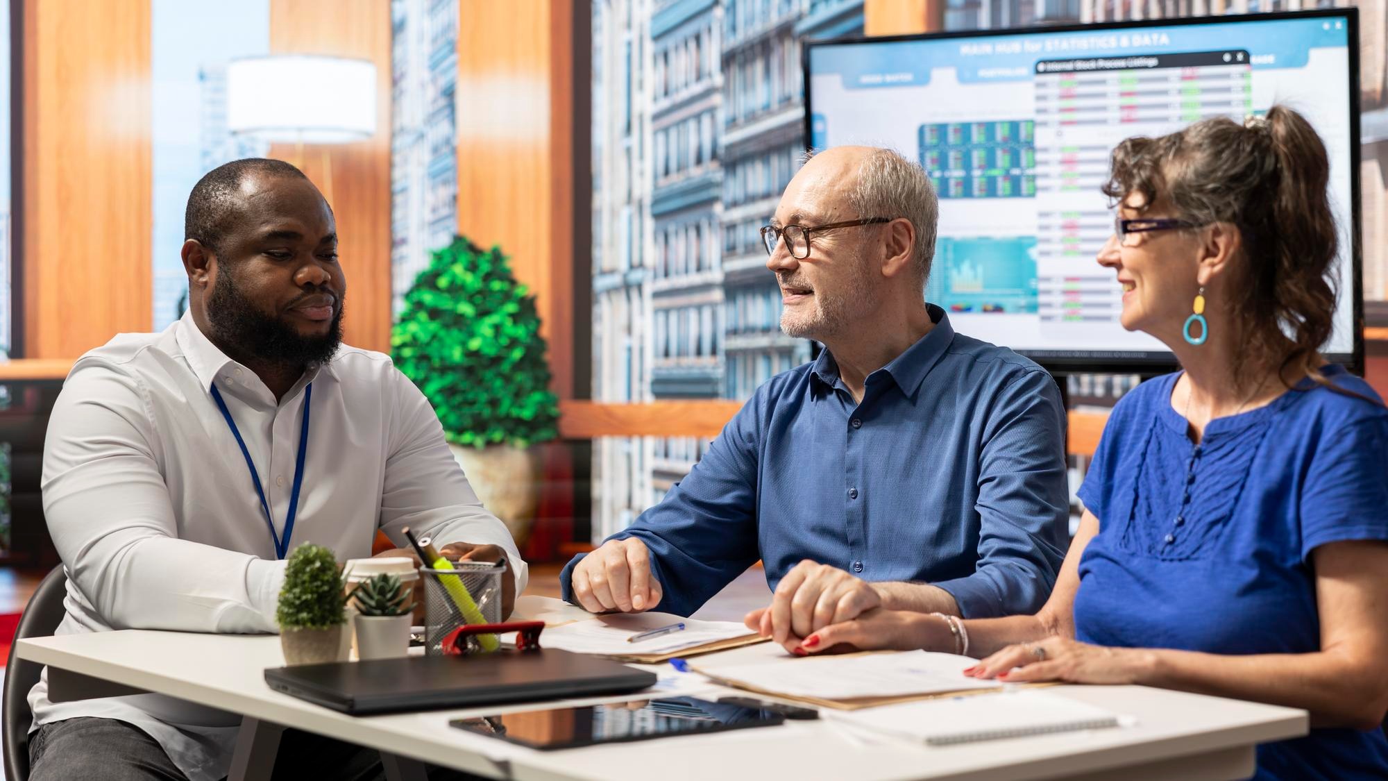 Mature couple consulting a financial planner about their retirement strategy