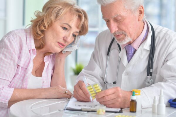 Close up portrait of senior doctor with elderly patient