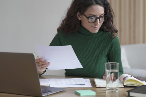 Young woman using laptop at office