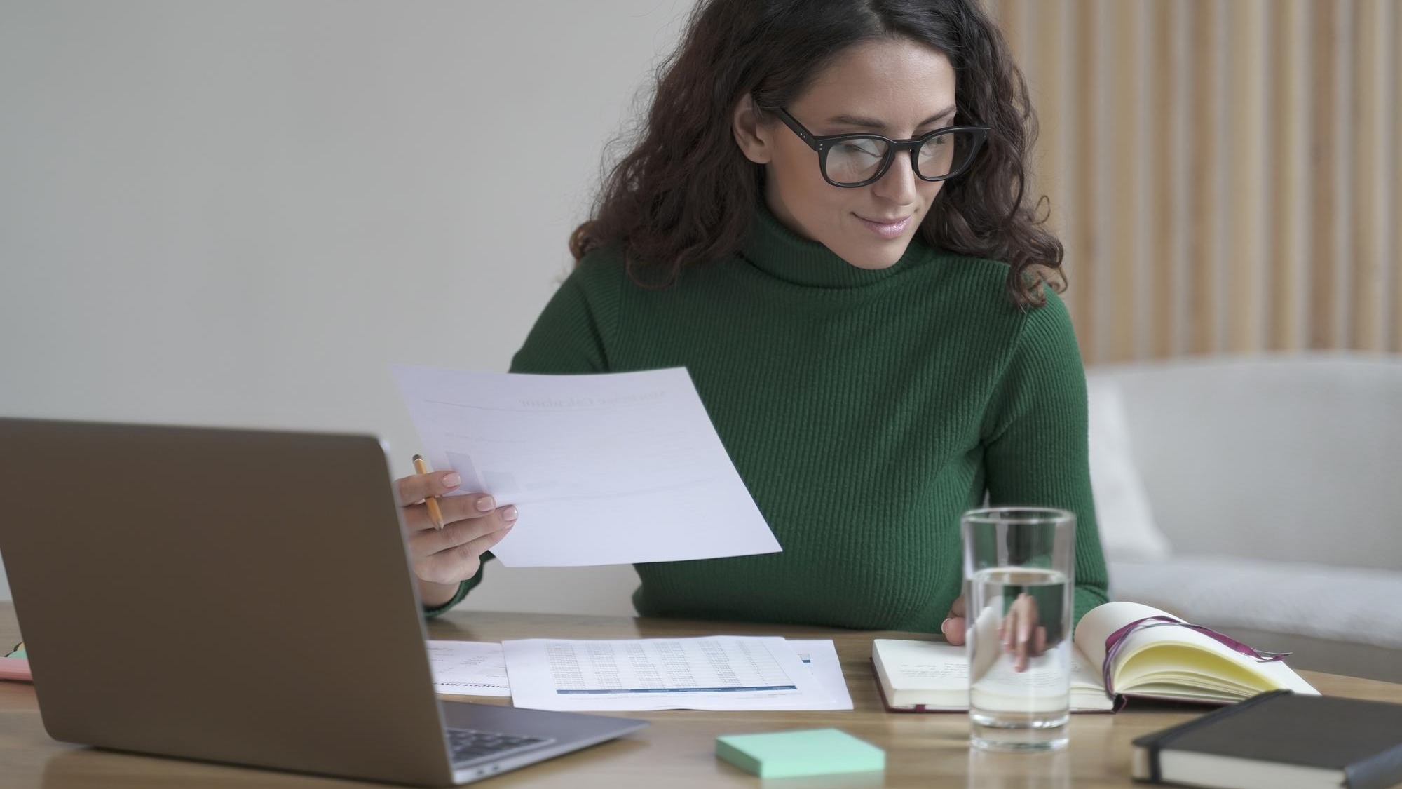 Young woman using laptop at office