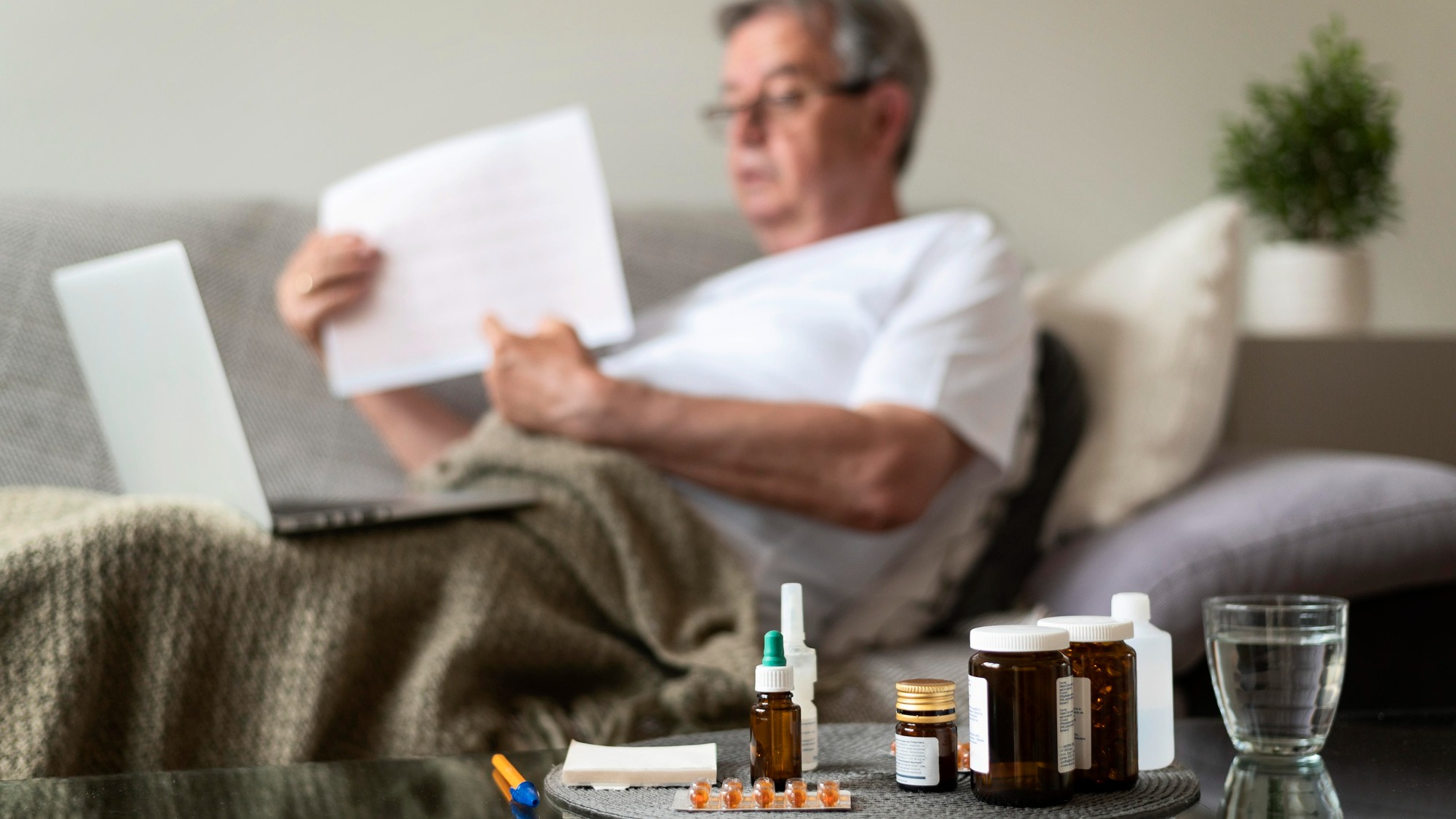 Medium shot blurry ill man on couch