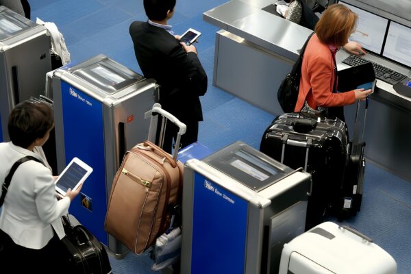 Travelers going through security checkpoint at airport