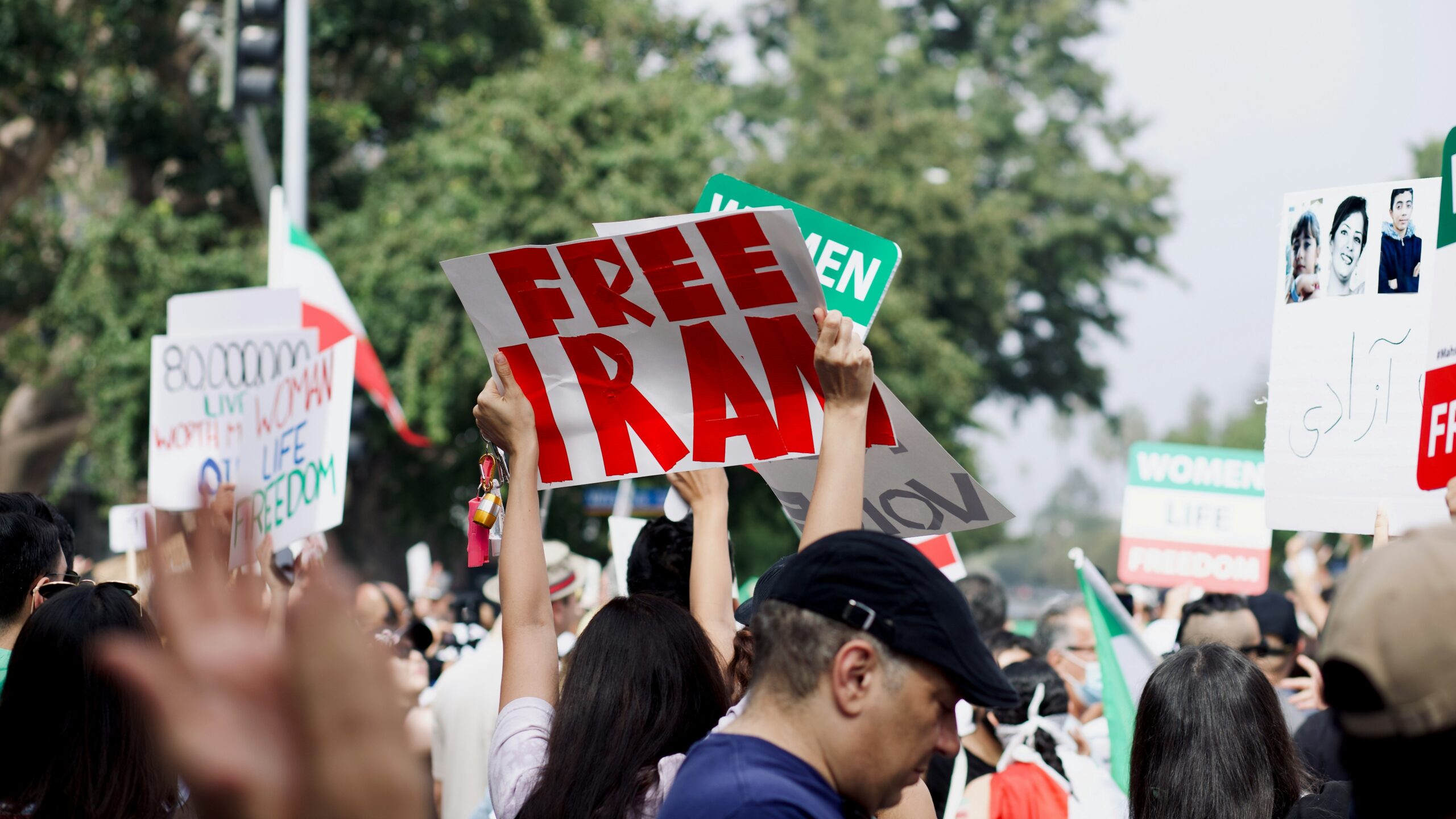 a group of people holding signs