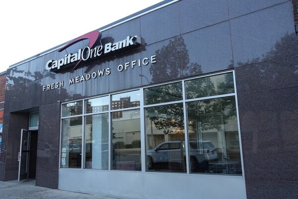 Looking at the Capital One Bank at the center of Building I from 188th Street in the western half of the Fresh Meadows Place Shopping Center, at 188th Street and 64th Avenue in Fresh Meadows, Queens. The bank retains the original stone (granite?) facade from the 1949 Jamaica Savings Bank.
